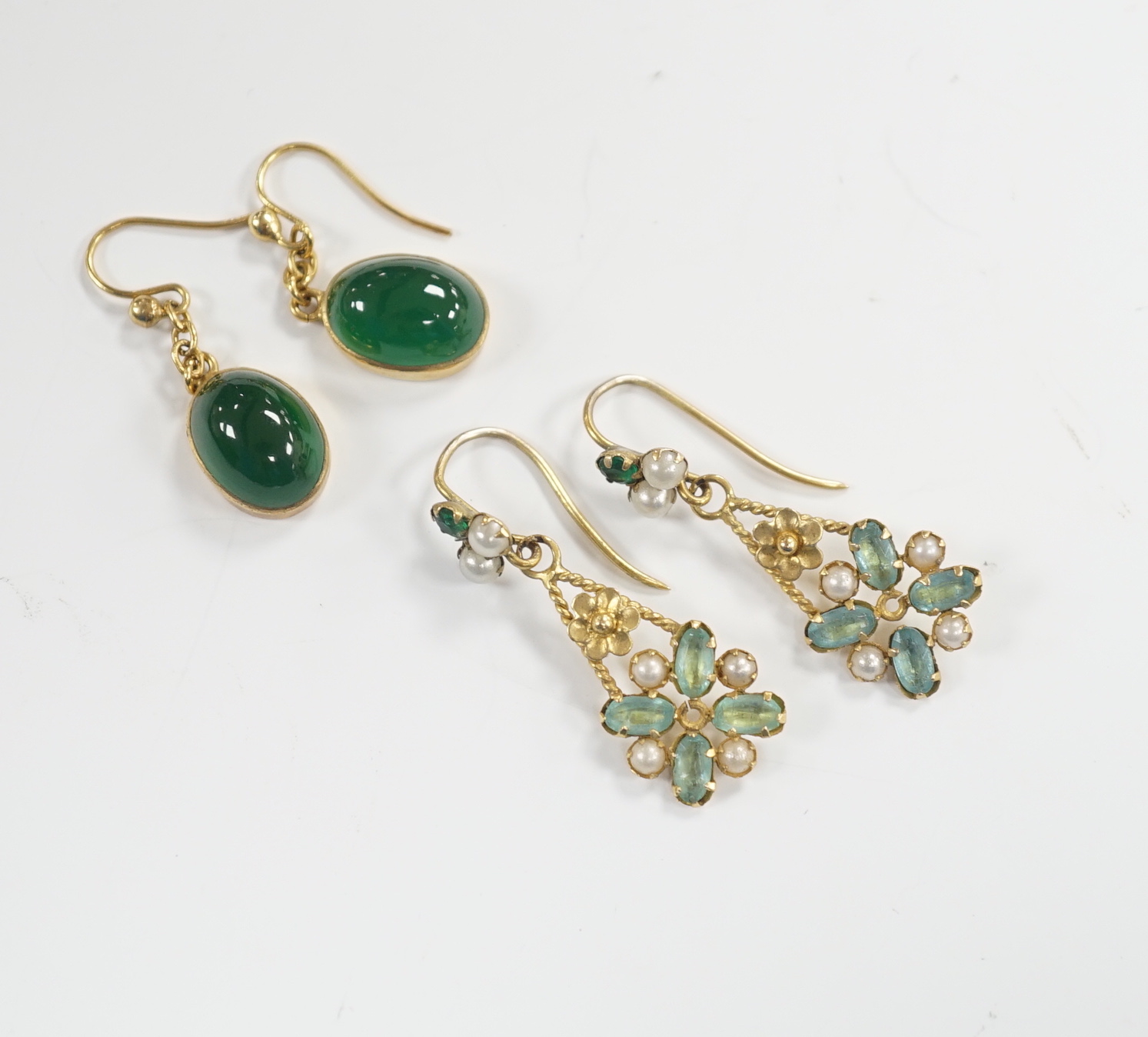 A pair of yellow metal and cabochon chrysoprase set drop earrings and a pair of yellow metal, aquamarine coloured stone and split pearl cluster set drop earrings, gross weight 5.6 grams.